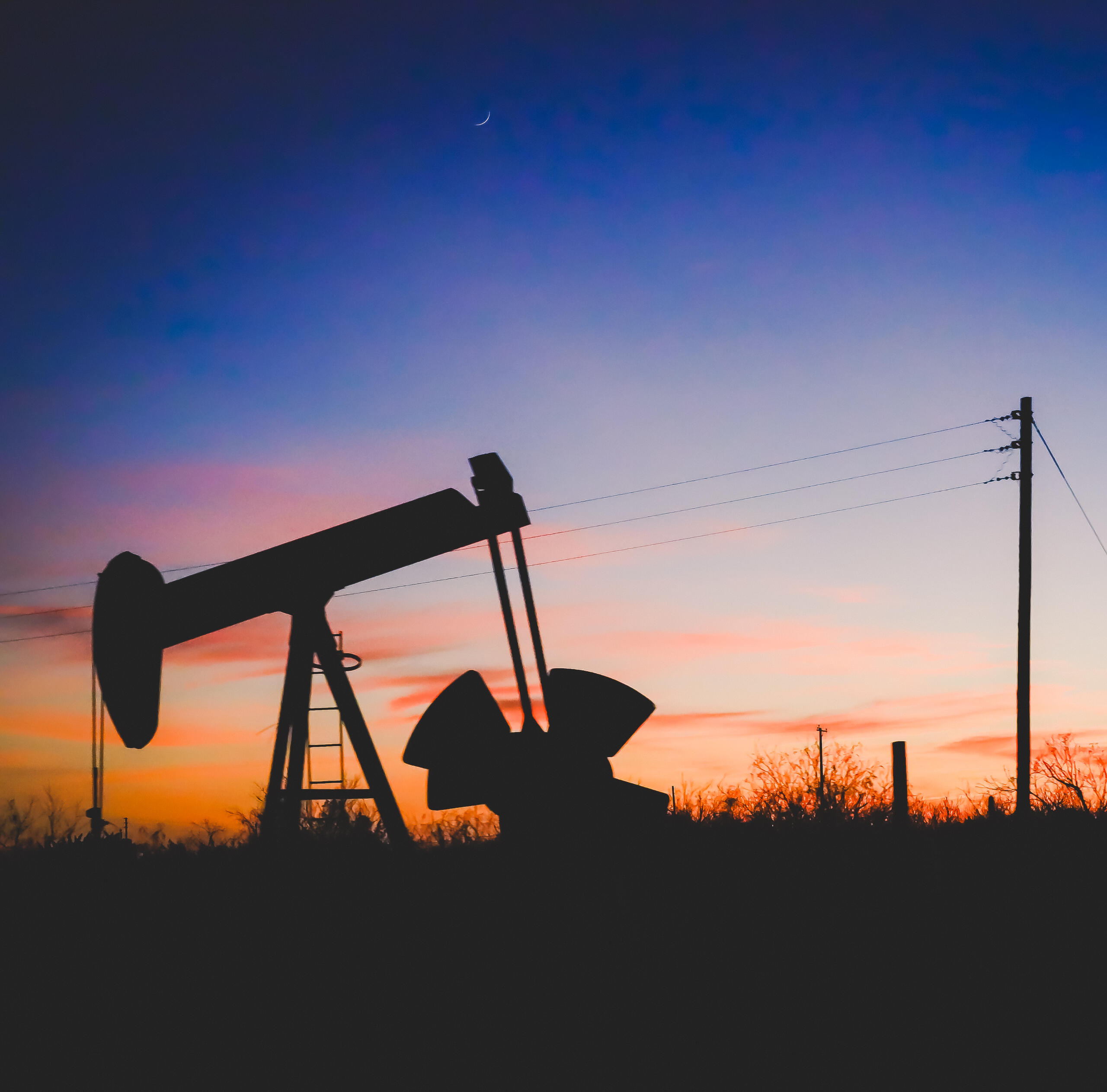 A pumping jack stands in an oilfield near Big Spring, Texas by Texas based photojournalist Matt Pierce.